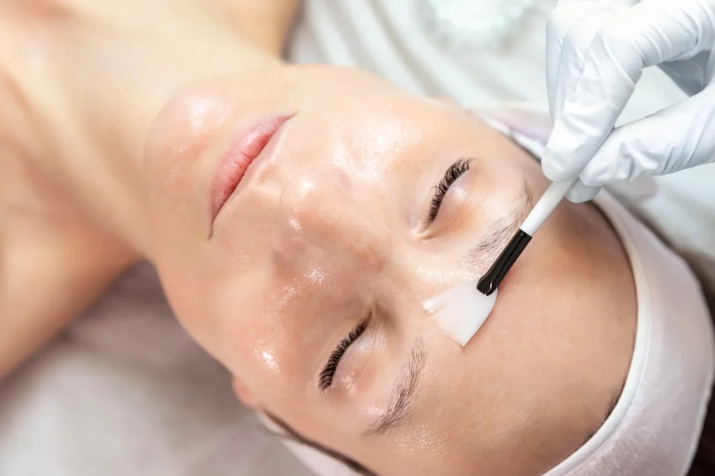 a person getting a facial mask