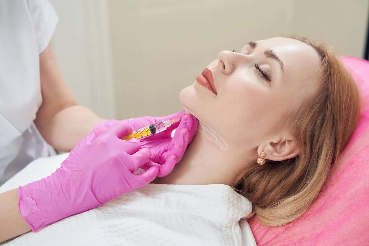 a woman receiving a botox injection