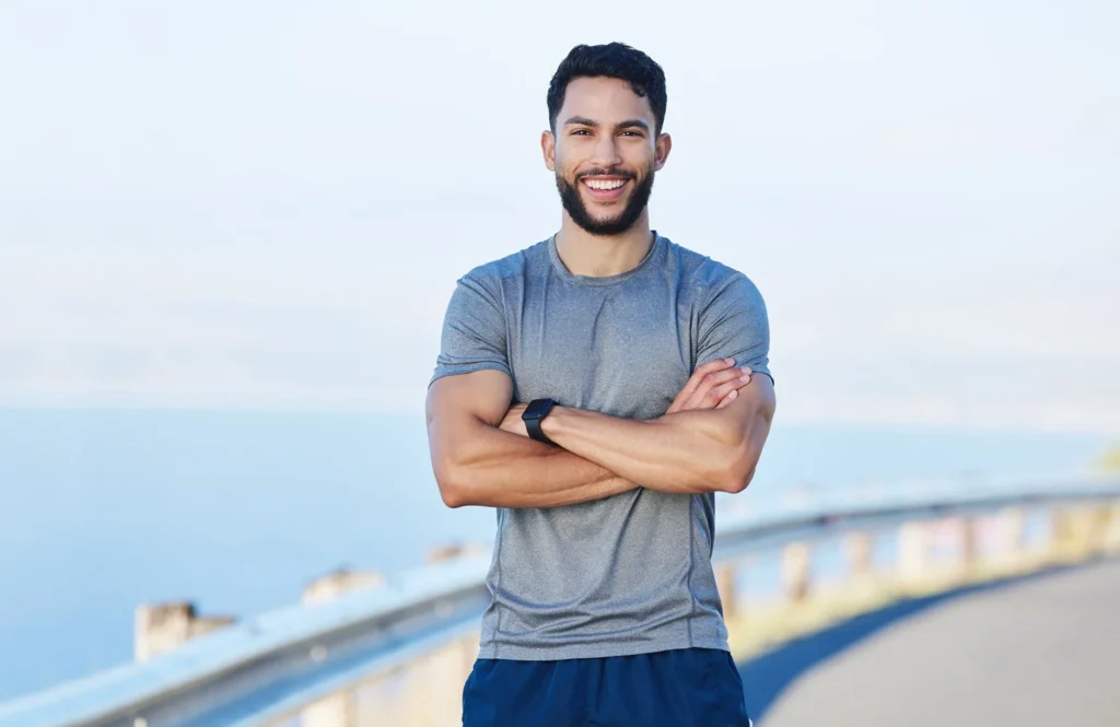 a man standing with his arms crossed