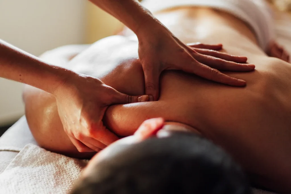 a person receiving a back massage