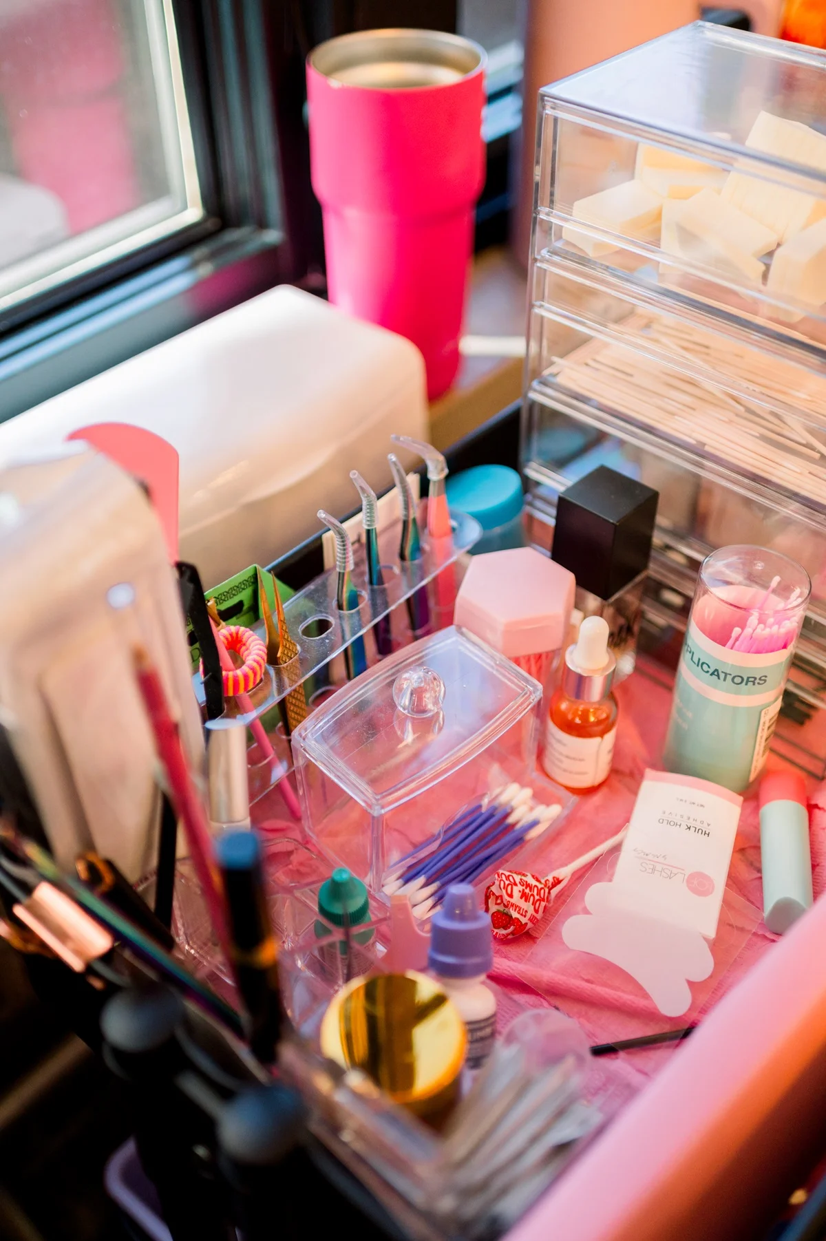 a makeup table with a variety of items